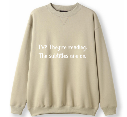 TV? They're reading. The subtitles are on Crewneck Sweater