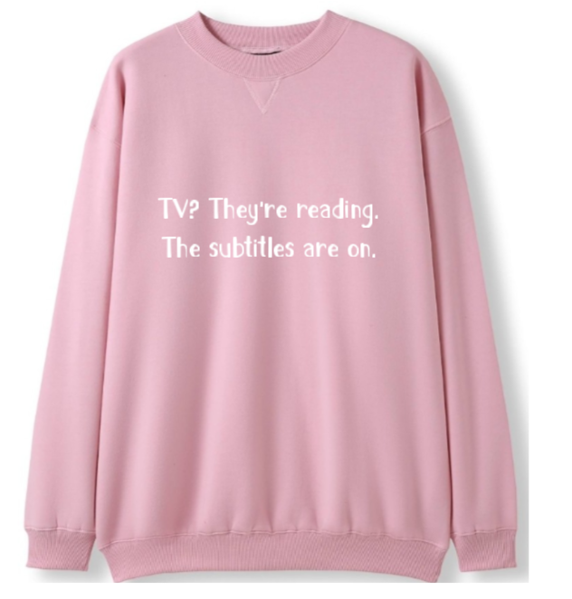 TV? They're reading. The subtitles are on Crewneck Sweater